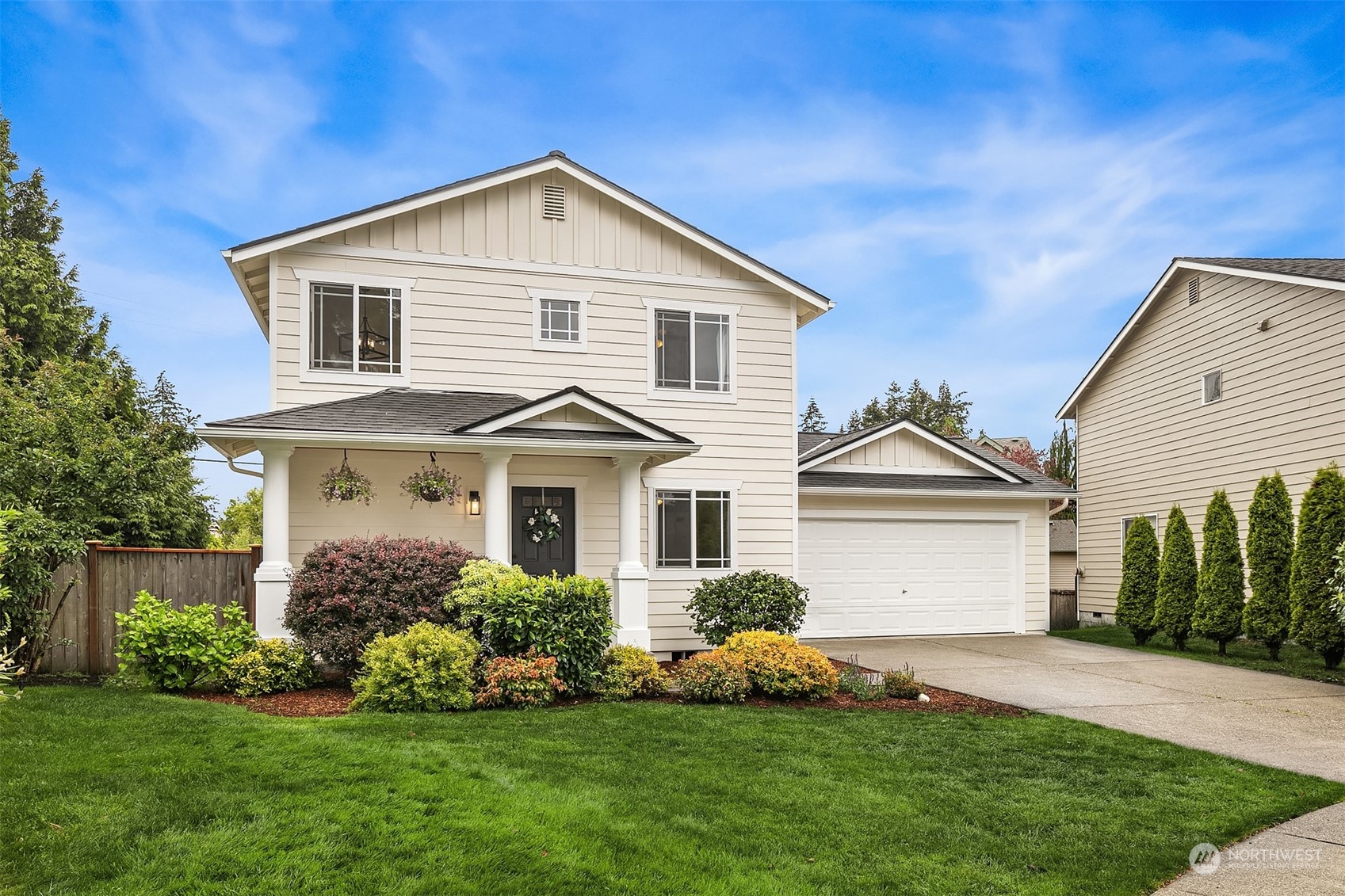 3410 189th Street Southeast Bothell, WA 98012 - Photo 3 of 23 a front view of a house with a garden