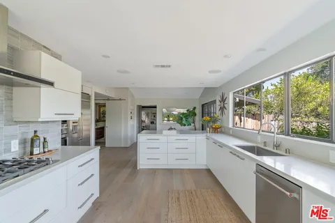 a view of outdoor space with playground and green space
