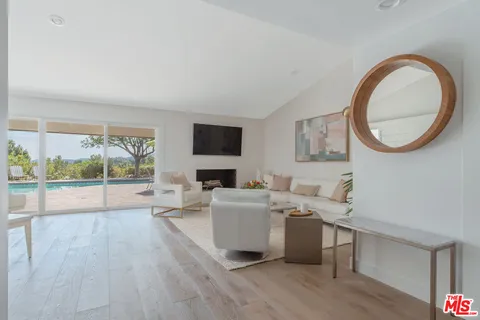 a view of a room with a table and chairs