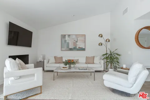 a view of a living room and dining room