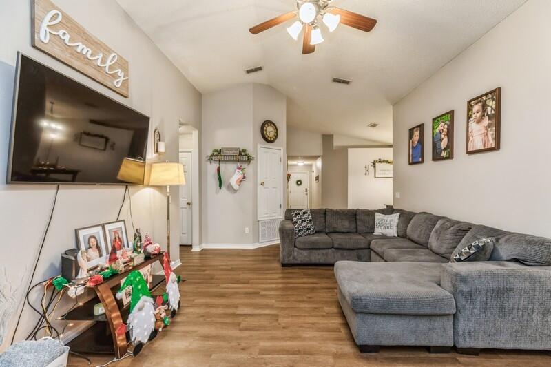 264 Limestone Circle Crestview, FL 32539 - Photo 11 of 38 a living room with furniture and a flat screen tv
