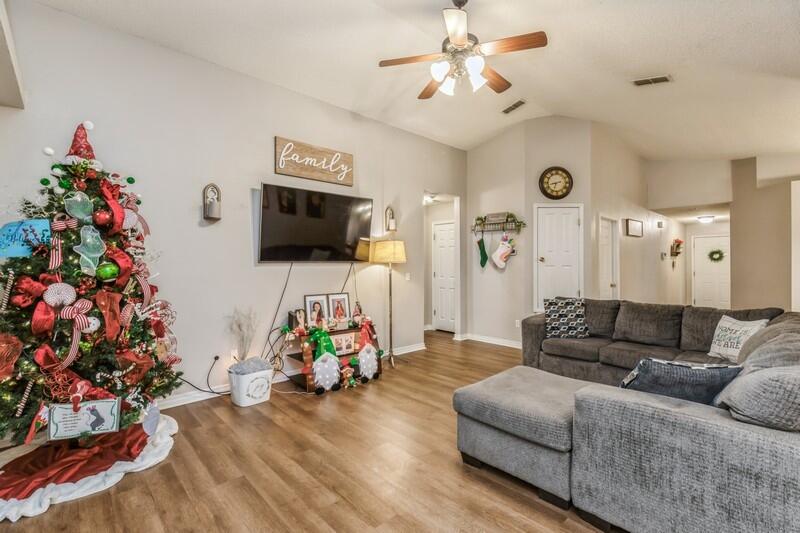 264 Limestone Circle Crestview, FL 32539 - Photo 12 of 38 a living room with furniture and a flat screen tv