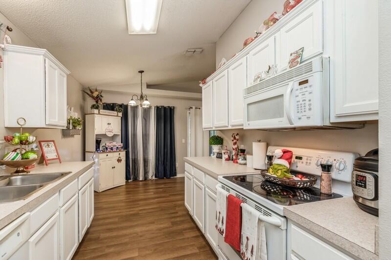 264 Limestone Circle Crestview, FL 32539 - Photo 17 of 38 a kitchen with stainless steel appliances a sink stove top oven and cabinets
