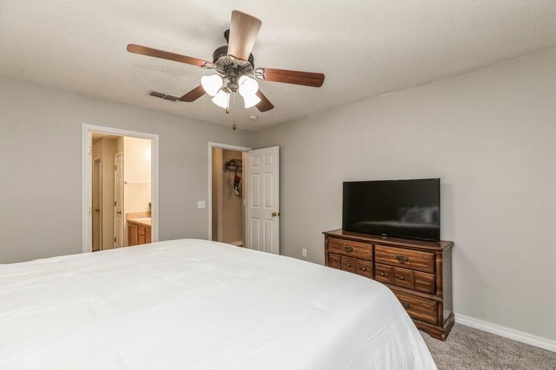 264 Limestone Circle Crestview, FL 32539 - Photo 22 of 38 a bedroom with a bed and a flat screen tv