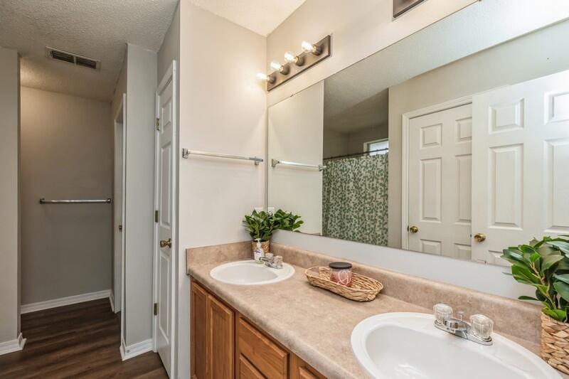 264 Limestone Circle Crestview, FL 32539 - Photo 23 of 38 a bathroom with a granite countertop sink and a mirror