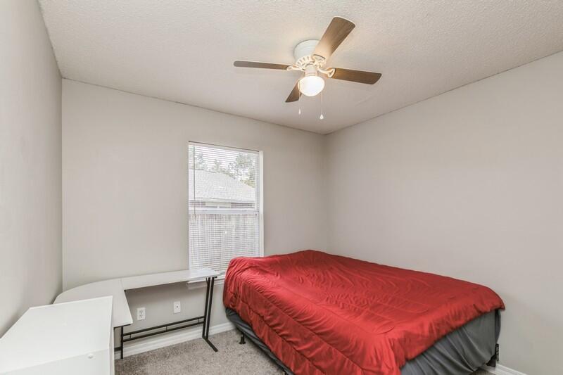 264 Limestone Circle Crestview, FL 32539 - Photo 26 of 38 a bedroom with a bed and a chandelier
