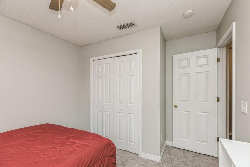 264 Limestone Circle Crestview, FL 32539 - Photo 27 of 38 a bedroom with a bed and a window