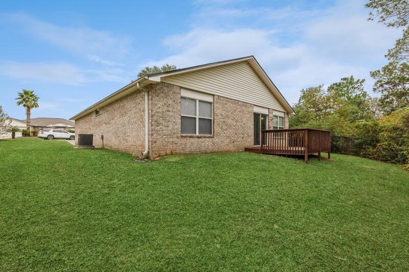 264 Limestone Circle Crestview, FL 32539 - Photo 37 of 38 a view of a house with backyard