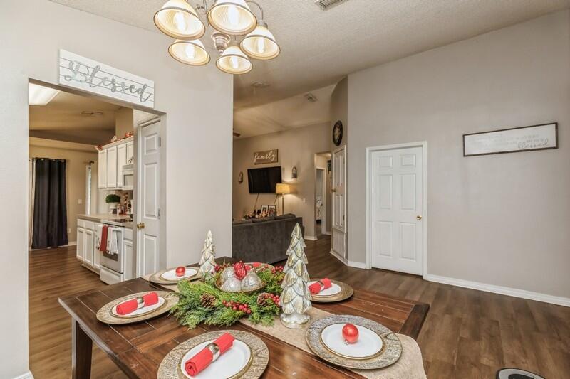 264 Limestone Circle Crestview, FL 32539 - Photo 6 of 38 a view of kitchen dining table and a wooden floor