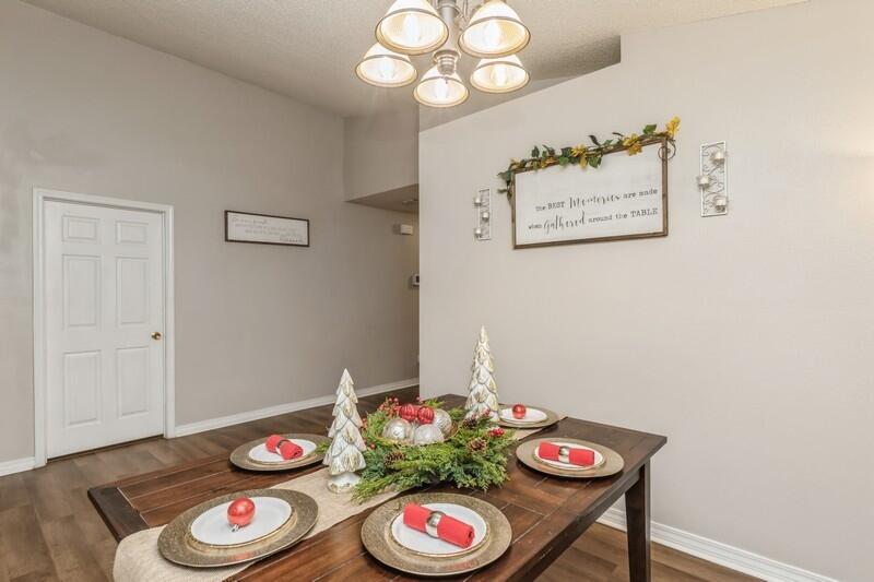 264 Limestone Circle Crestview, FL 32539 - Photo 7 of 38 a view of a dining room with furniture and wooden floor