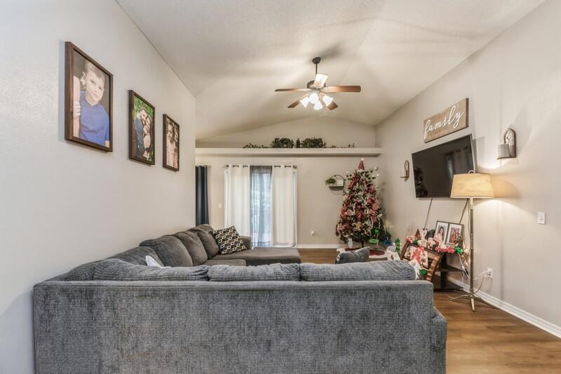 264 Limestone Circle Crestview, FL 32539 - Photo 8 of 38 a living room with furniture and a chandelier