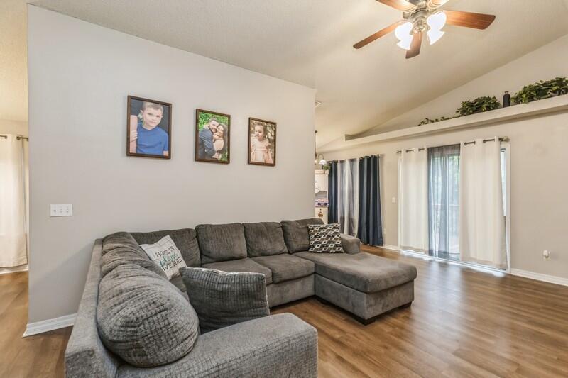 264 Limestone Circle Crestview, FL 32539 - Photo 9 of 38 a living room with furniture and a wooden floor