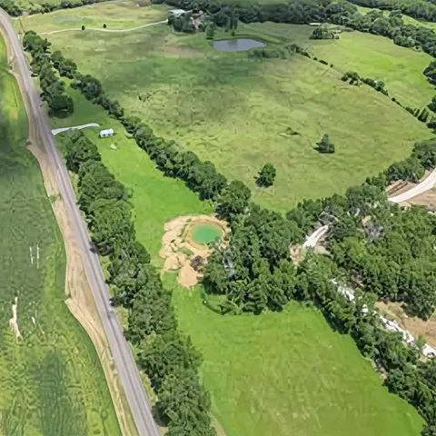 a view of a lake with a yard