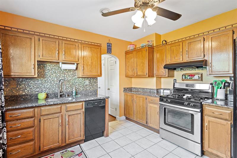 46 Herbst Road Coraopolis, PA 15108 - Photo 4 of 21 Tile Backsplash and Granite Counters for an updated look.
