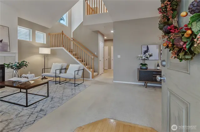 a living room with furniture and flowers