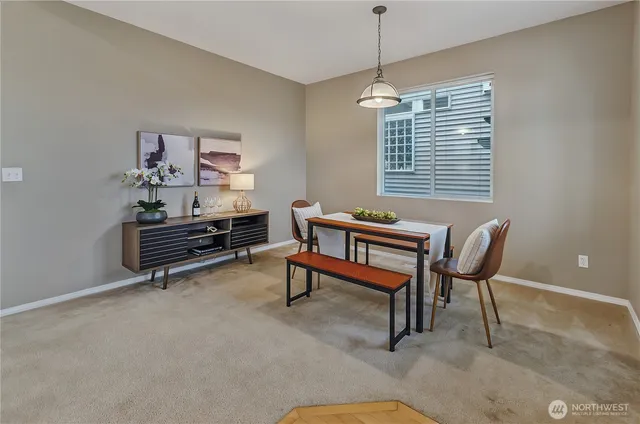 a living room with furniture a window and a chandelier