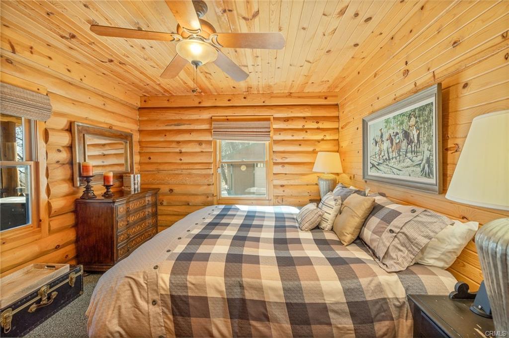 52815 Timberview Road North Fork, CA 93643 - Photo 20 of 75 a bedroom with a bed and wooden floor