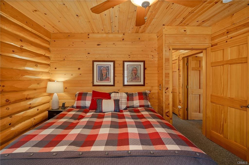 52815 Timberview Road North Fork, CA 93643 - Photo 23 of 75 a bedroom with a bed and wooden floor