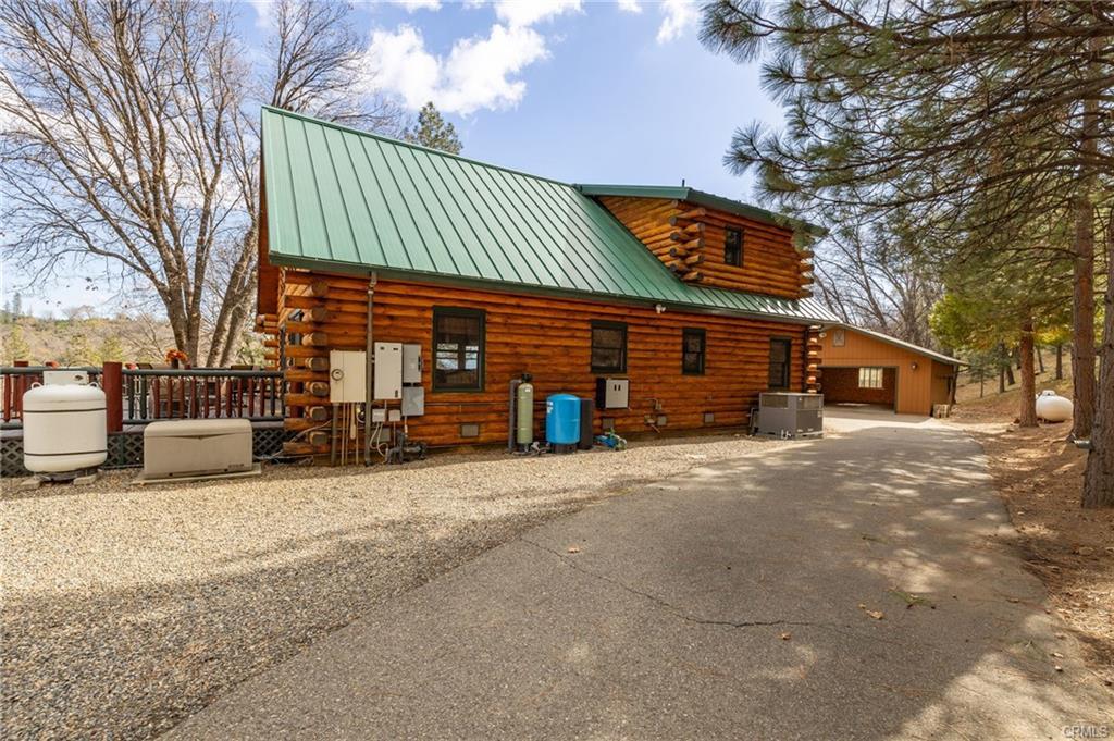 52815 Timberview Road North Fork, CA 93643 - Photo 35 of 75 a view of a house with a yard and garage