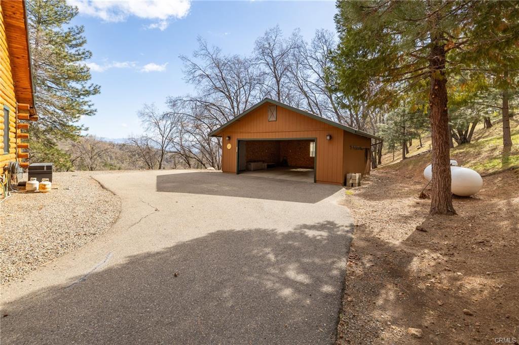 52815 Timberview Road North Fork, CA 93643 - Photo 47 of 75 a front view of a house with a yard covered with snow