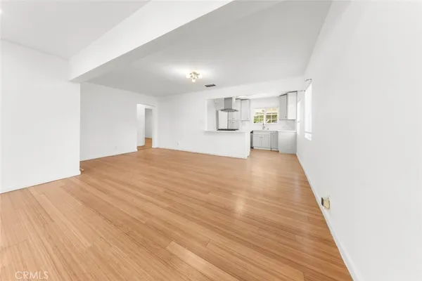 a view of a kitchen with wooden floor