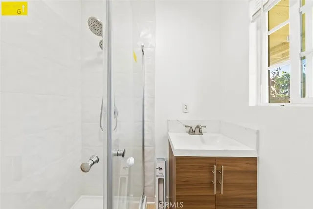 a kitchen with cabinets and stainless steel appliances