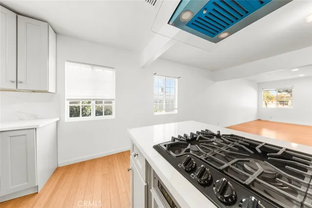 a view of a backyard with wooden fence