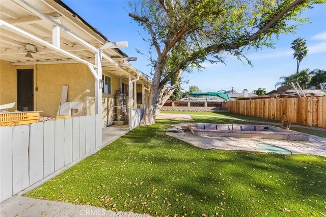 a bedroom with furniture and a large window