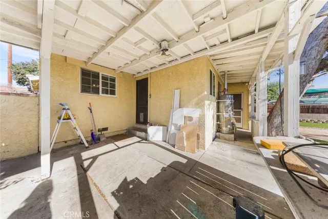 a view of a backyard with a sitting area