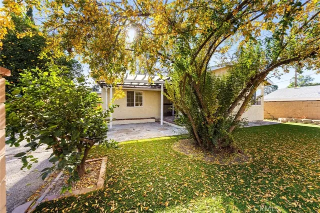 a view of a barn with wooden fence