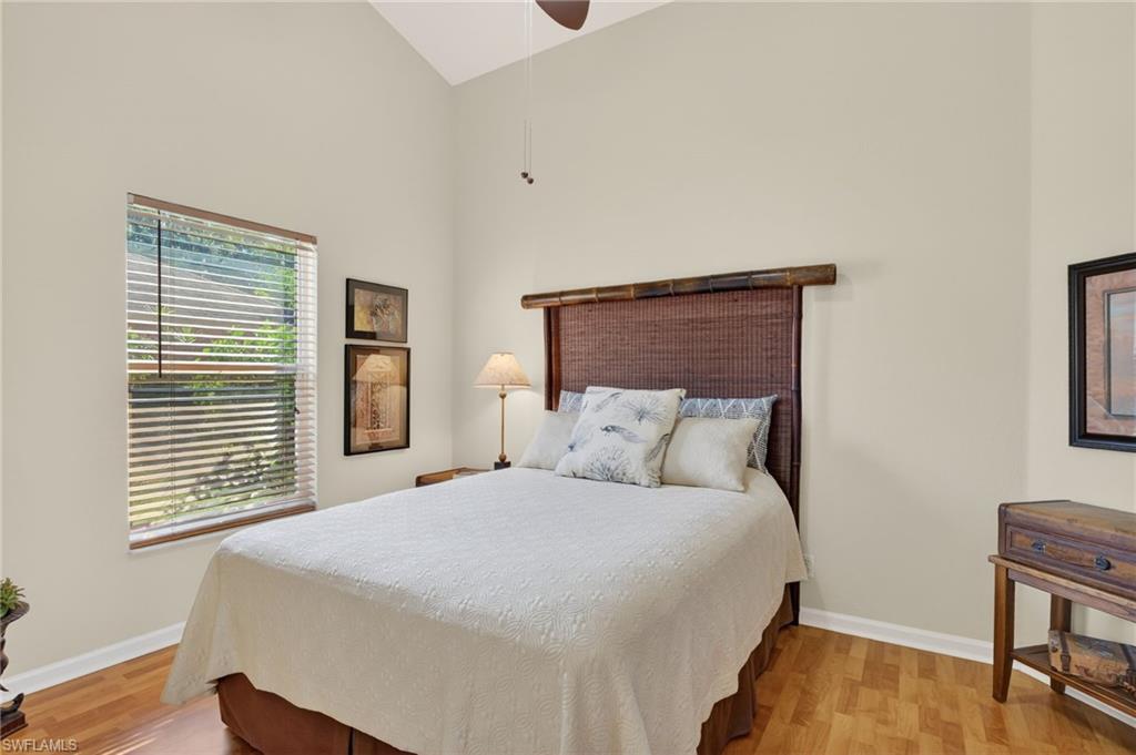 22818 Snaptail Court Estero, FL 33928 - Photo 16 of 37 a bedroom with a bed and a window