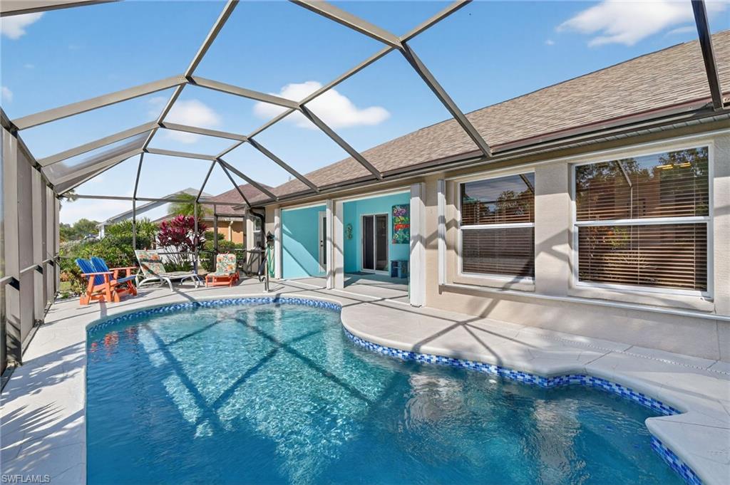 22818 Snaptail Court Estero, FL 33928 - Photo 32 of 37 a view of a house with backyard porch and sitting area