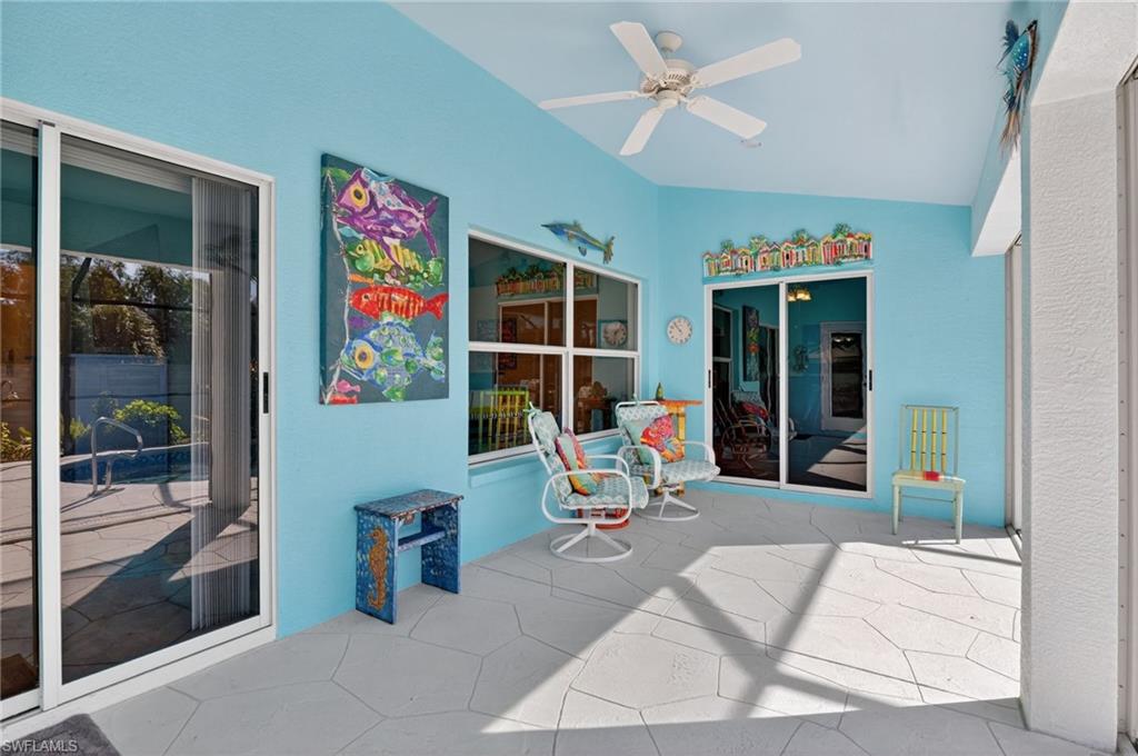 22818 Snaptail Court Estero, FL 33928 - Photo 35 of 37 a living room with furniture and a large window