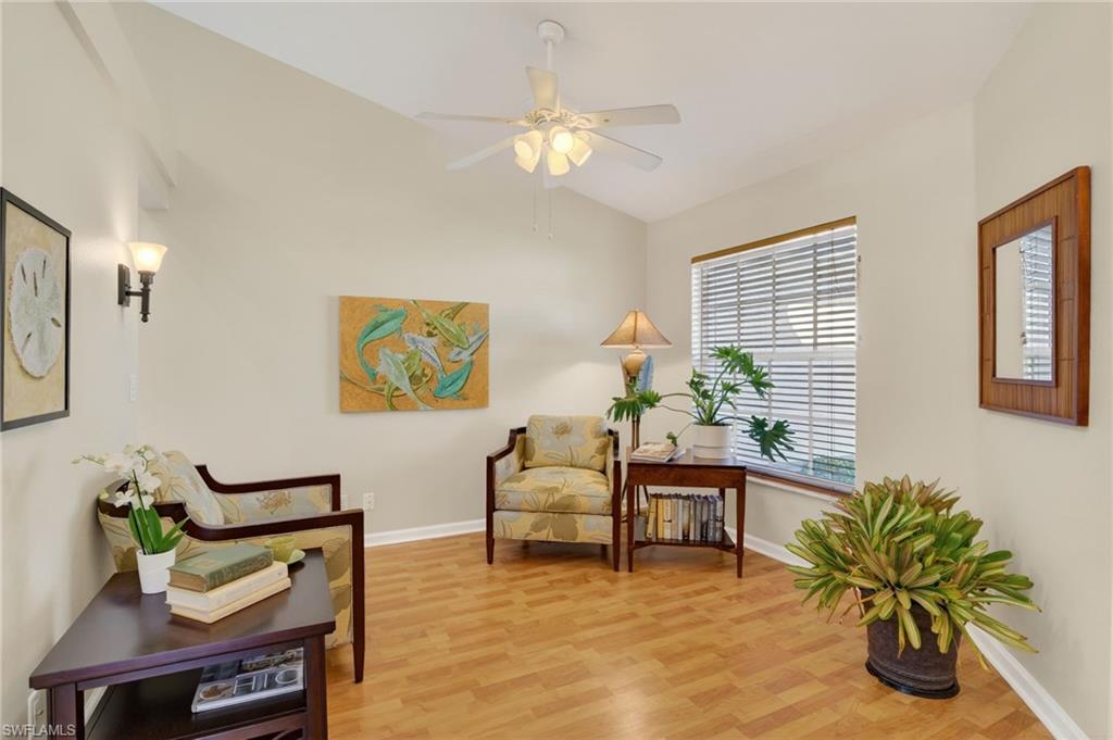 22818 Snaptail Court Estero, FL 33928 - Photo 8 of 37 a living room with furniture and a potted plant