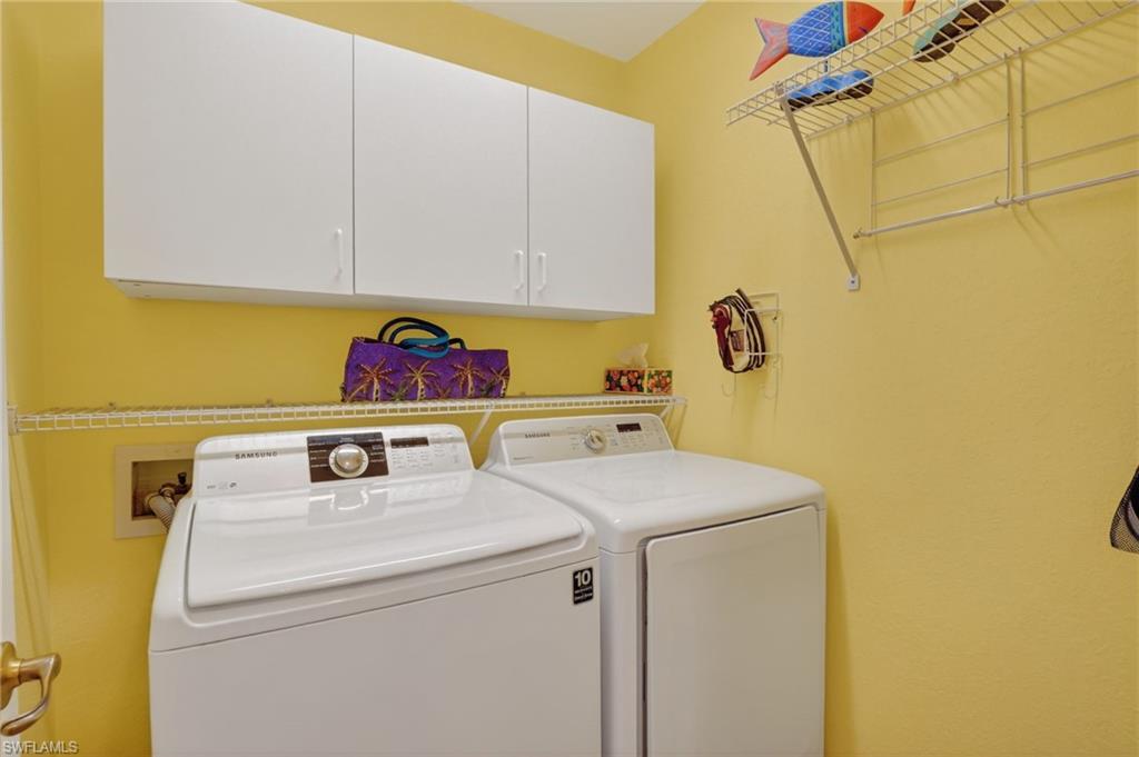 22818 Snaptail Court Estero, FL 33928 - Photo 10 of 37 a utility room with dryer and washer