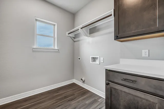 a view of a storage and utility room with closet