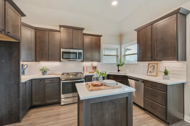 a kitchen with a sink and cabinets