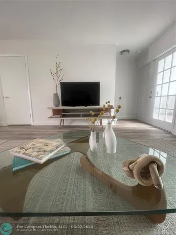 a living room with furniture and a rug