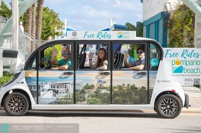 a view of a patio with dining table and chairs under an umbrella