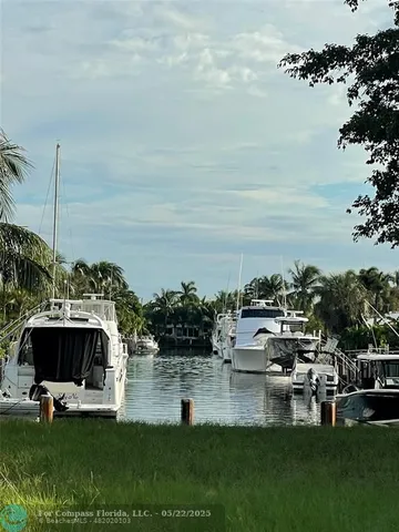 a swimming pool with outdoor seating and yard