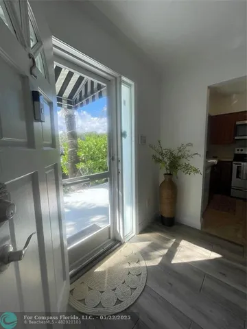 a kitchen with stainless steel appliances kitchen island granite countertop a stove a sink and a microwave