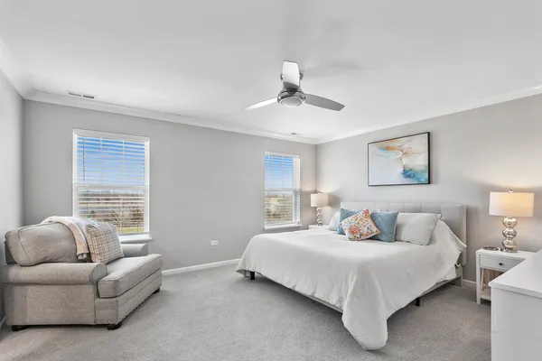 a bedroom with bed and window