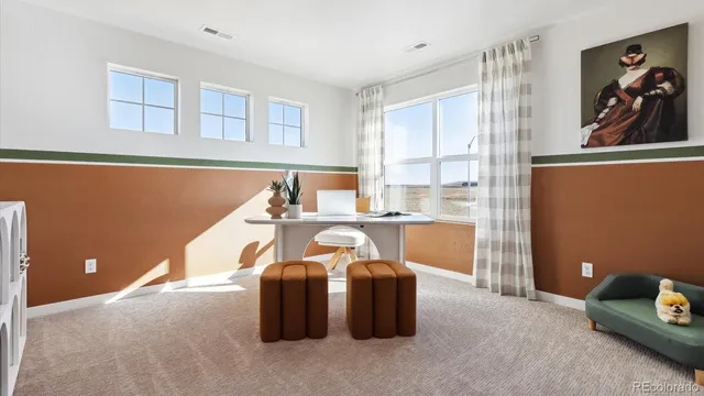 a workspace with furniture and window