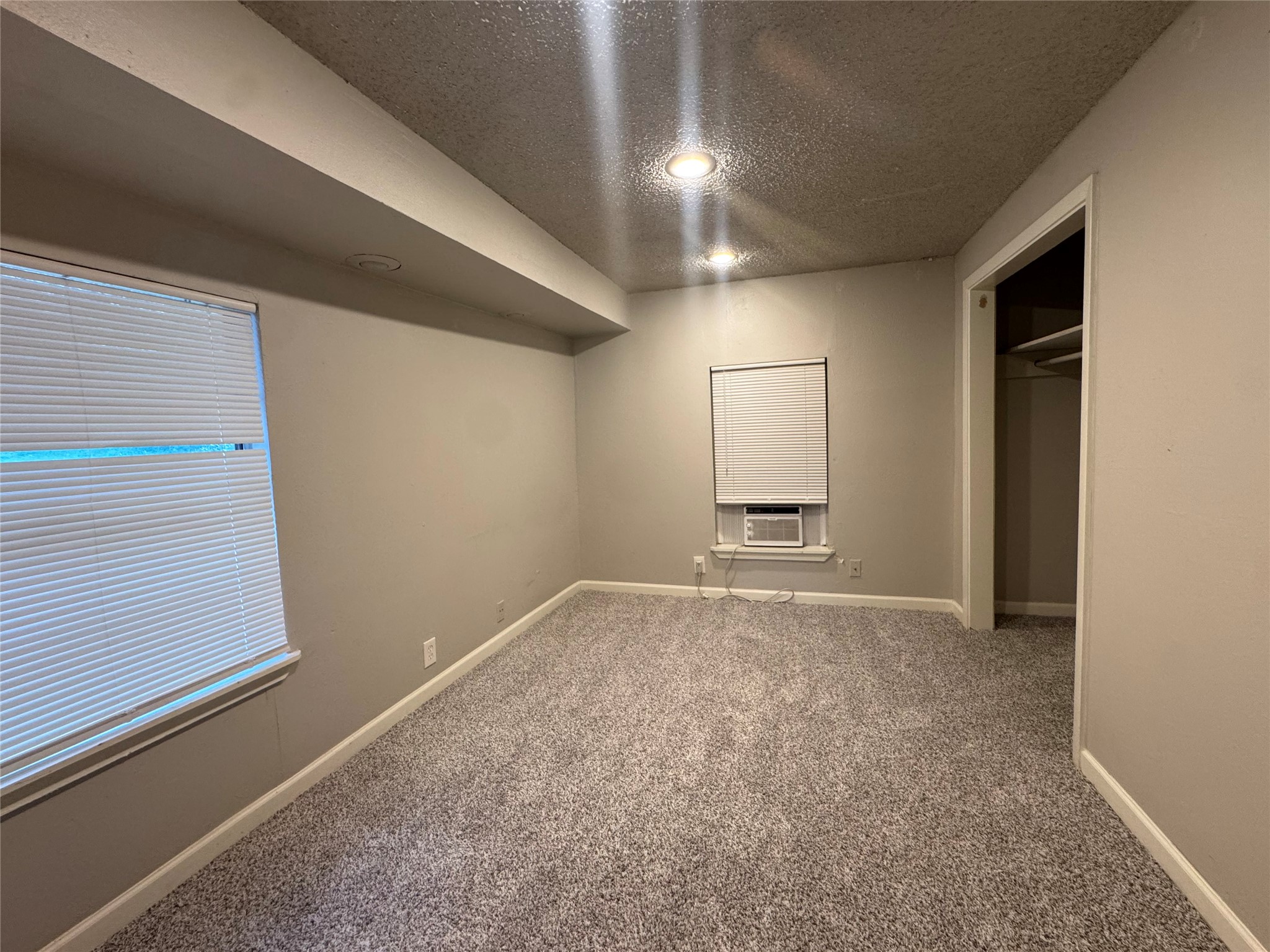 5007 Heflin Lane Austin, TX 78721 - Photo 12 of 25 A well-proportioned bedroom with ample natural light offers a comfortable retreat.