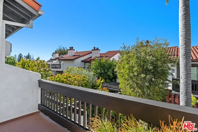 a view of a street from a balcony
