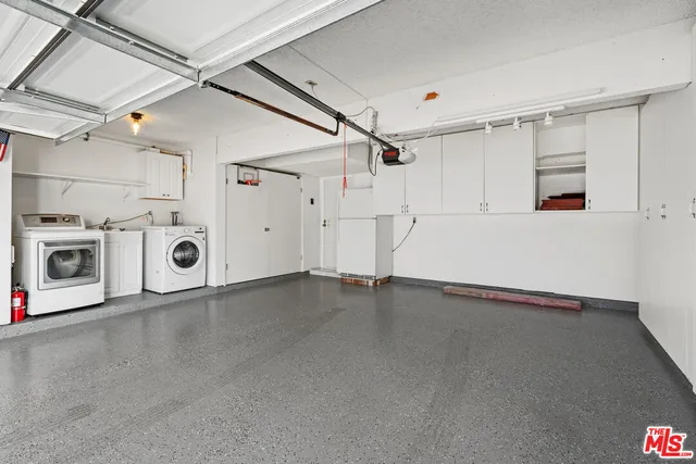 a view of a utility room with washer and dryer