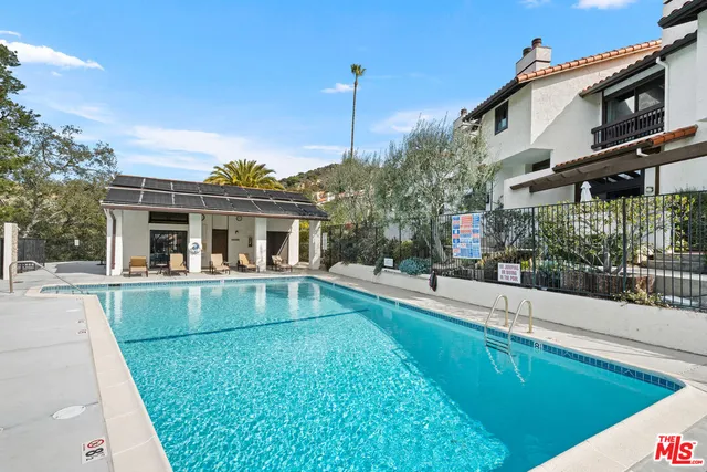 a view of a swimming pool with a lake view