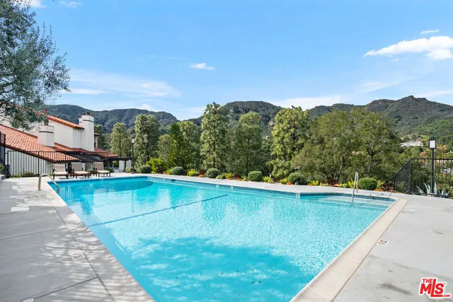 a view of a two chairs in a patio