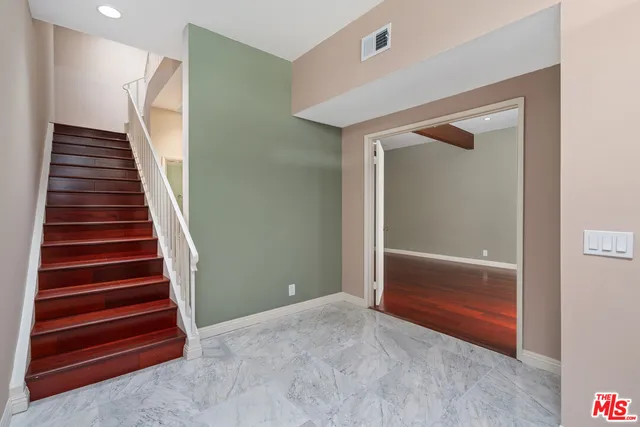 a view of entryway with wooden floor