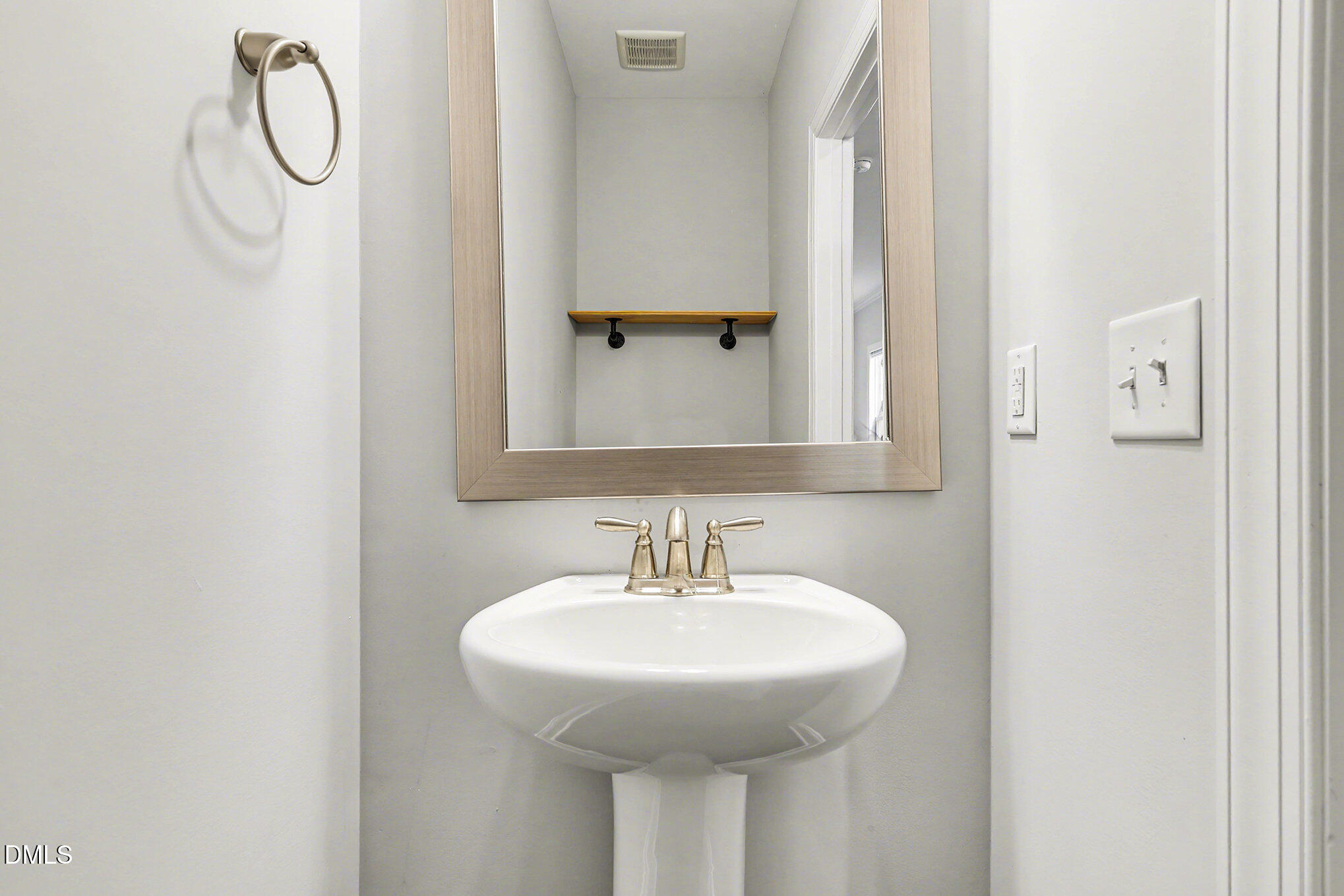 274 Howards Crossing Drive Wendell, NC 27591 - Photo 13 of 40 a bathroom with a sink and a mirror
